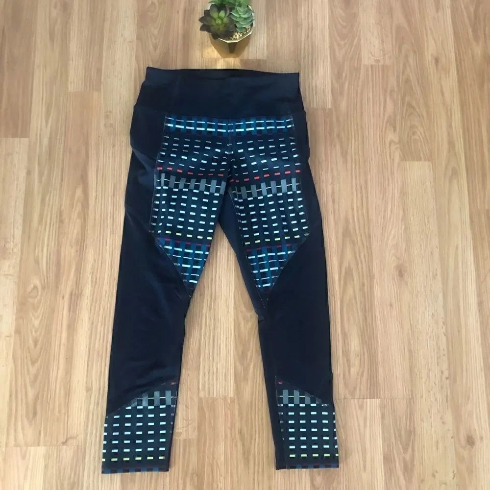 ATHLETA Blue Mesh Geometric Multicolor Zipped Side Pockets Capri Leggings